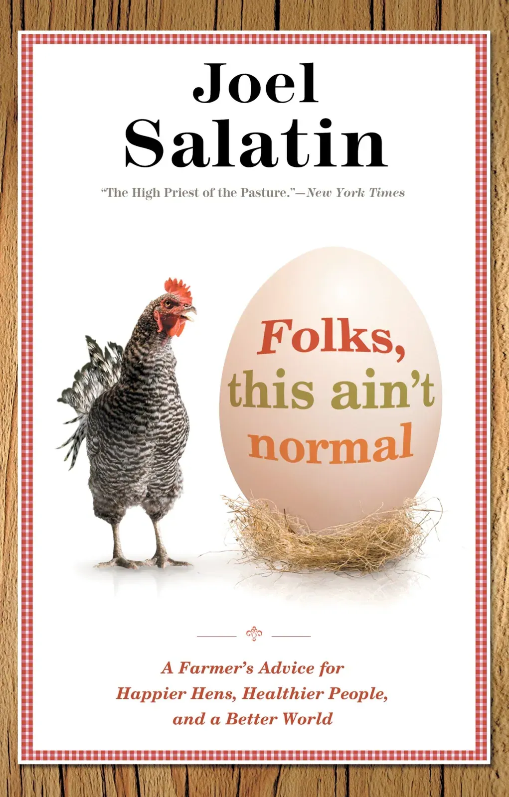 Folks, This Ain't Normal (Joel Salatin): Front cover of Folks, This Ain't Normal by Joel Salatin: a barred hen beside a large egg in a straw nest, framed by a red gingham border on wood.