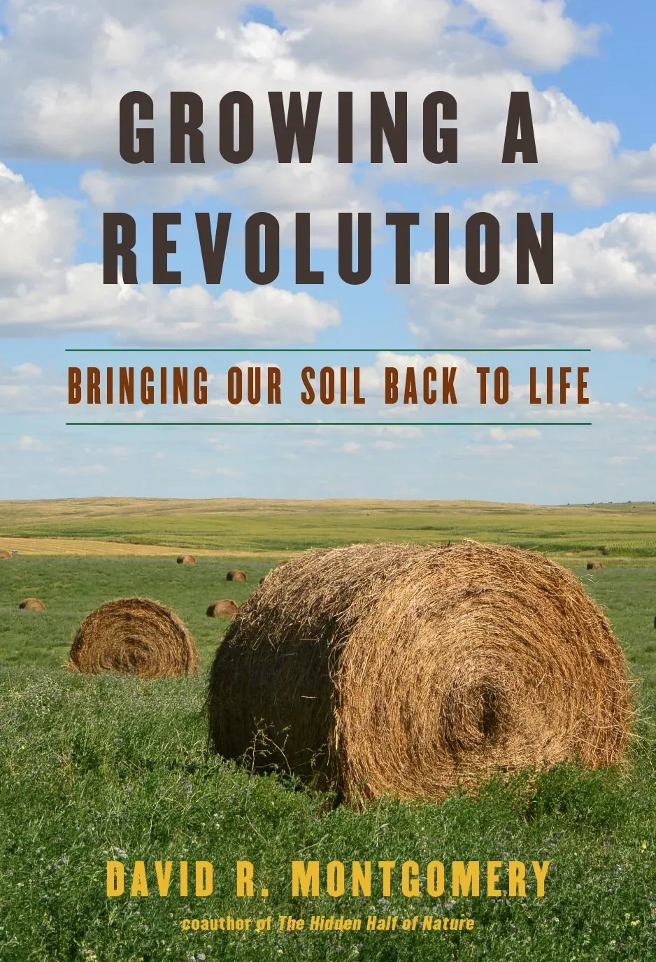 Growing a Revolution (David R. Montgomery): Front cover of Growing a Revolution: Bringing Our Soil Back to Life by David R. Montgomery, with round hay bales on a green prairie under a cloudy blue sky.