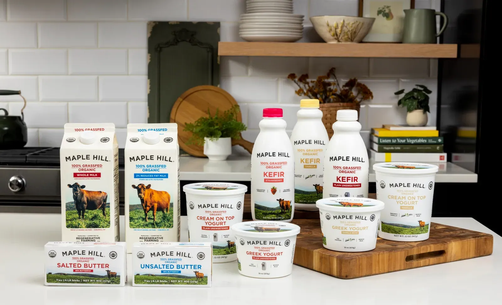 Maple Hill Creamery: The Maple Hill grass-fed organic range of milk, kefir, cream-on-top and Greek yogurt and butter arranged on a kitchen counter.